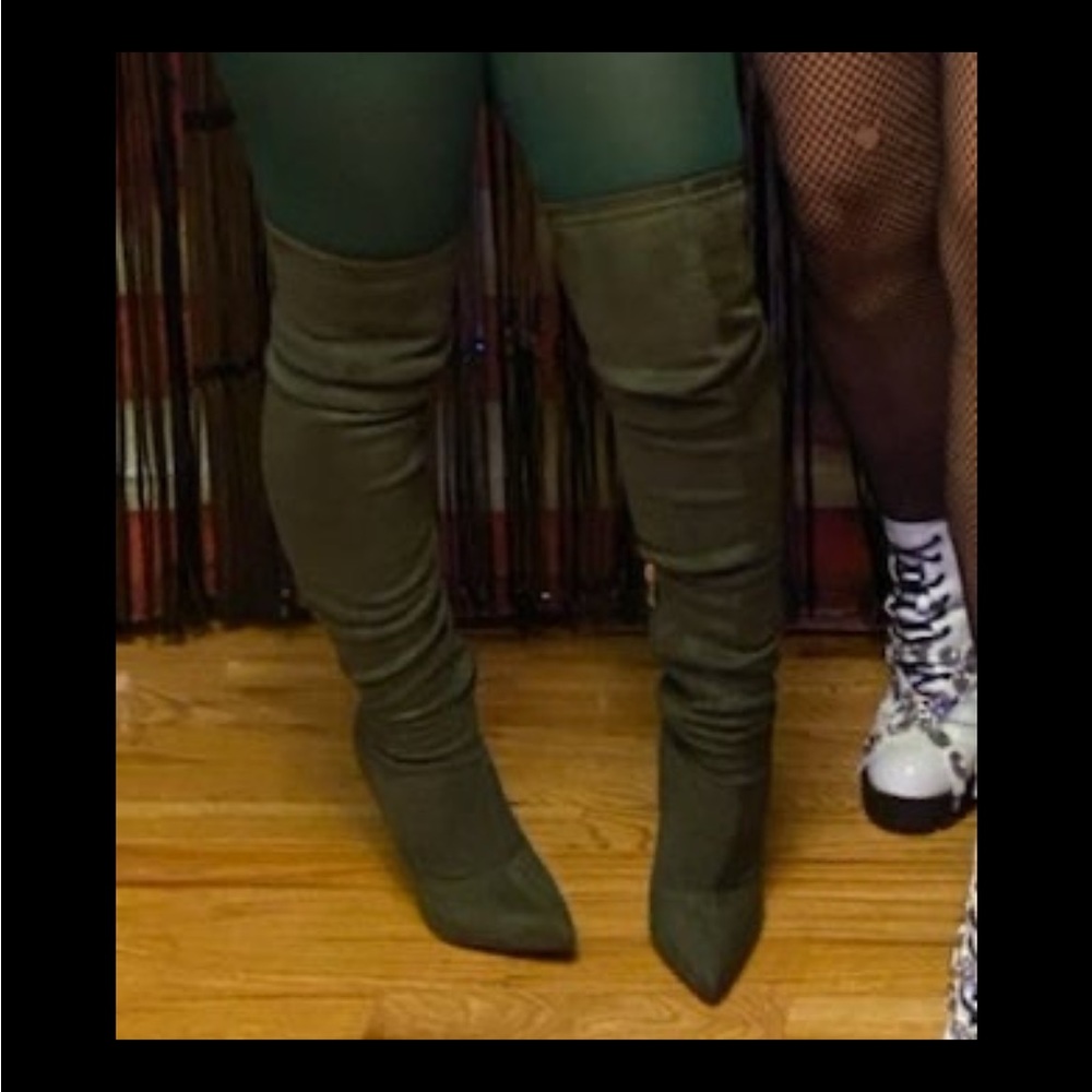 Knee high, high heel suede boots.